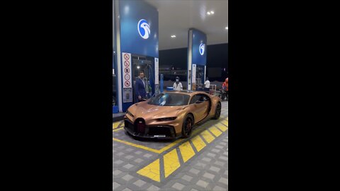 PUTTING GAS IN THE BUGATTI