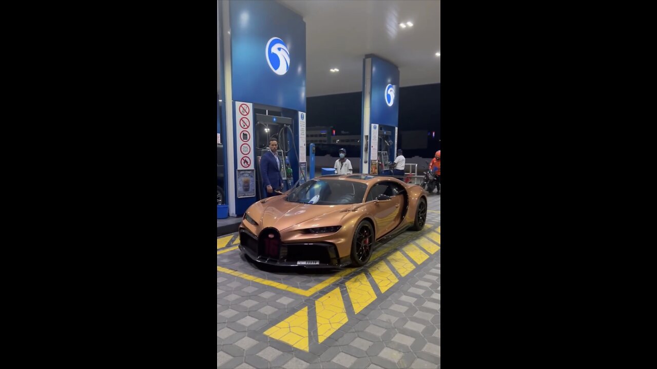 PUTTING GAS IN THE BUGATTI