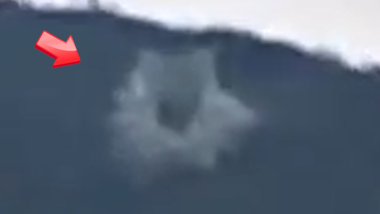 Ring-shaped UFO hiding behind a mountain