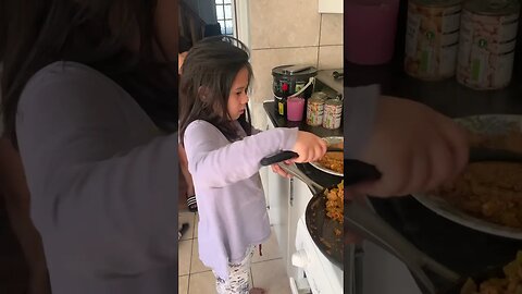 Little girl is very good in the Kitchen-sardines with eggs