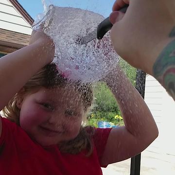 Dad Bursts A Water Balloon On Daughter’s Head