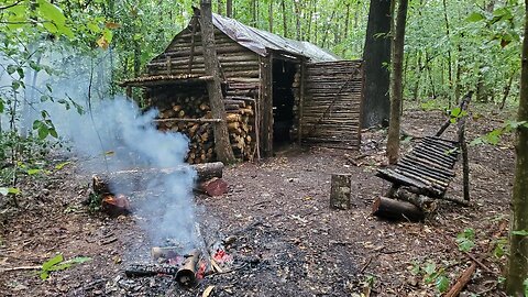 Bushcraft Log Cabin Camping in Rain Storm - Repairing and upgrading my survival shelter with my son
