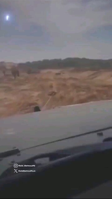 🇮🇱 Zionist Jewish terrorists pull a Palestinian man behind their vehicle.