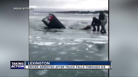 Police arrest driver after truck falls through ice