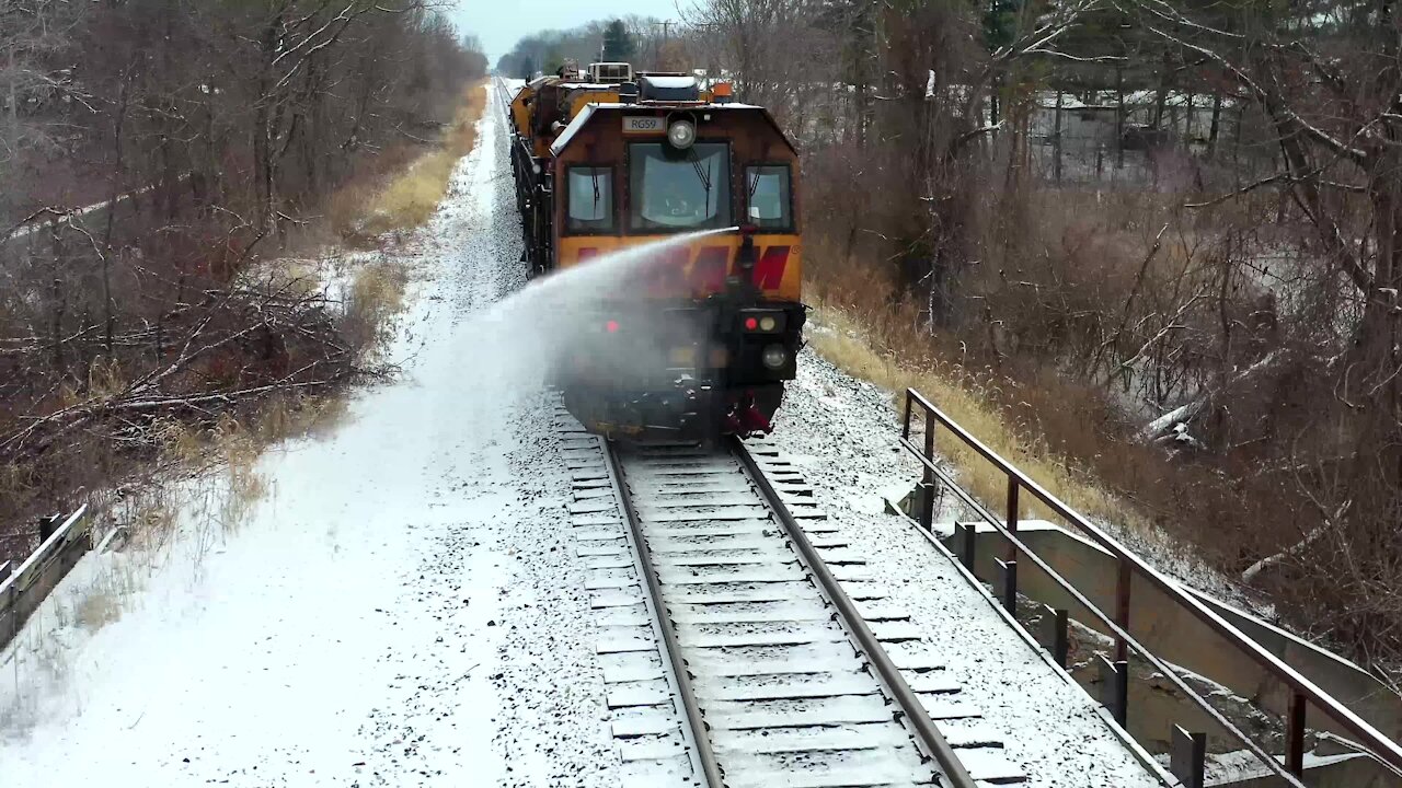 Train almost takes out drone with water canon