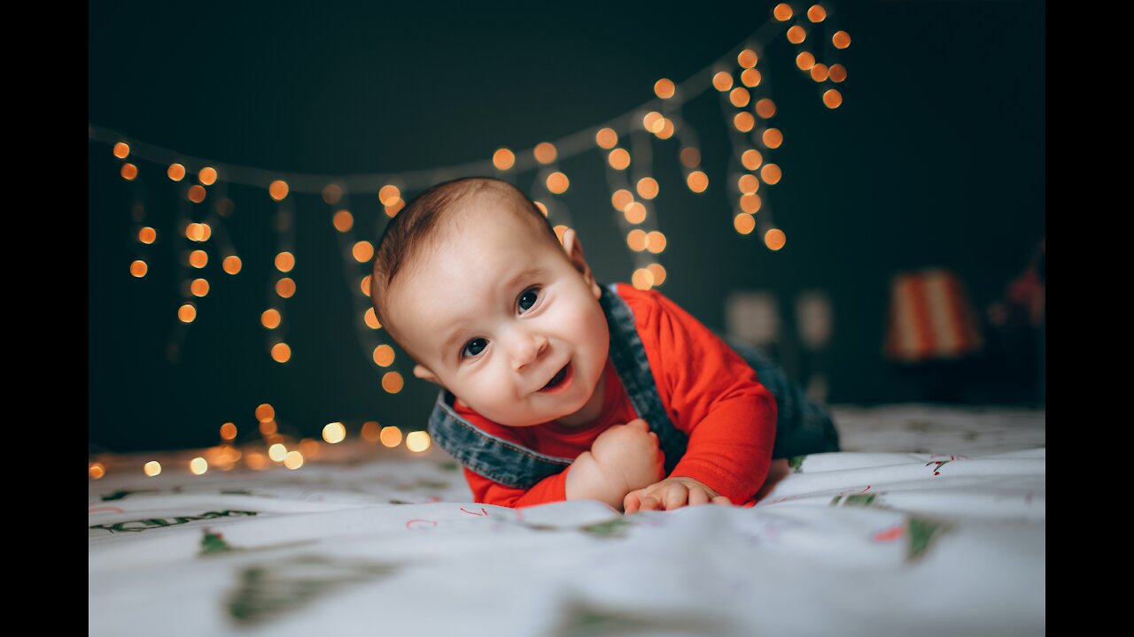 Cute baby plays with his hand on your cheek 👶