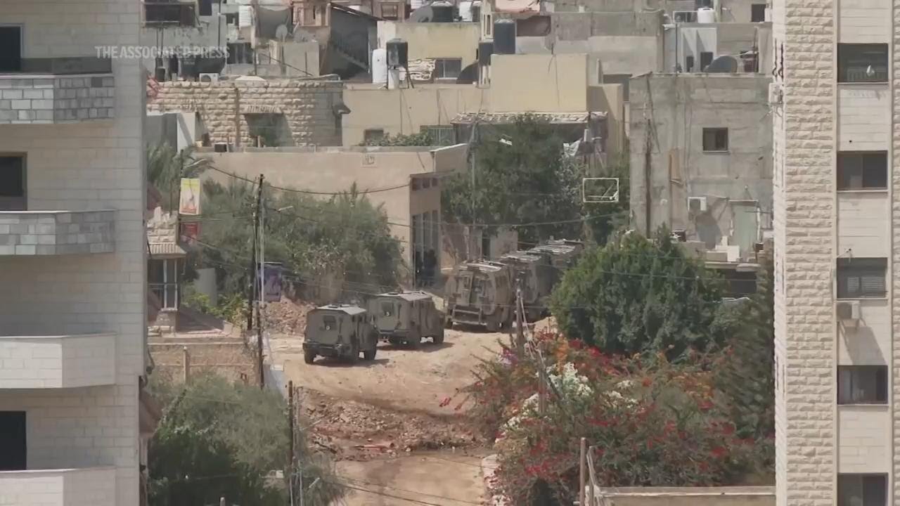 Israeli military vehicles seen moving in Jenin, West Bank and helicopters overhead