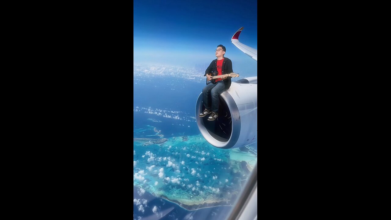 Playing guitar on an airplane turbine