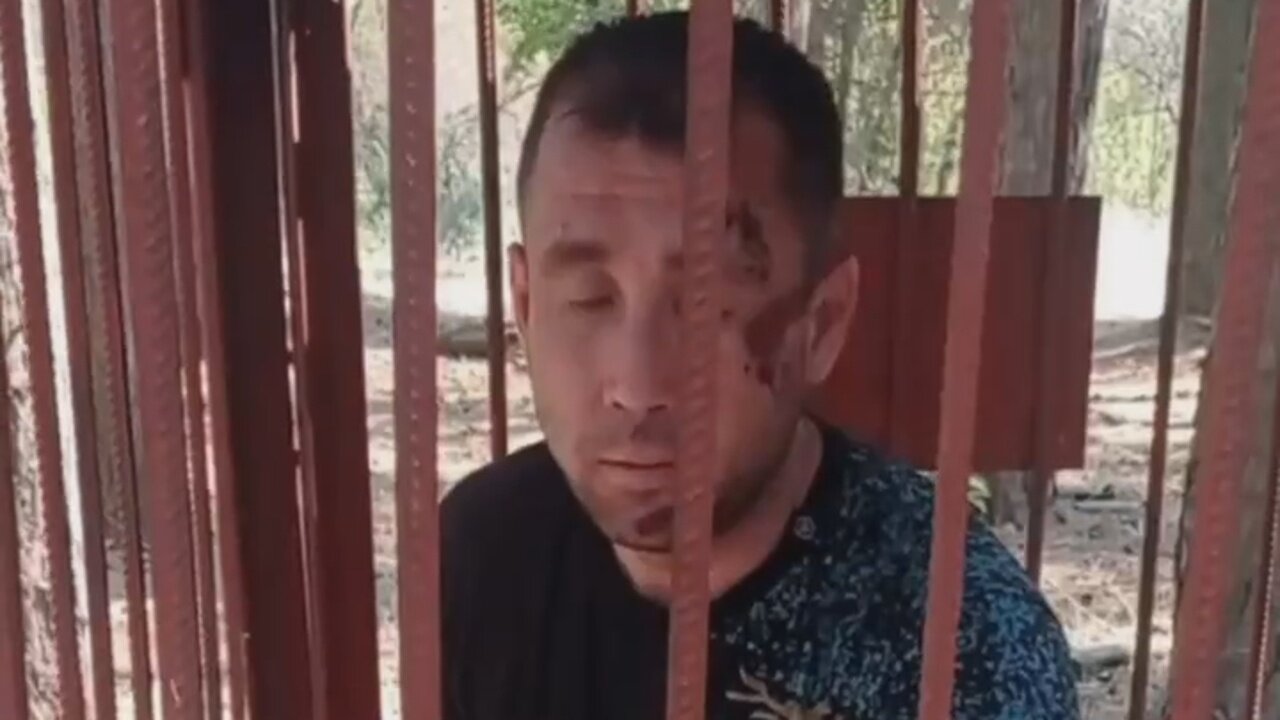 A Russian soldier was put in a cage for refusing to take part in a "meat assault" on Ukrainian positions.