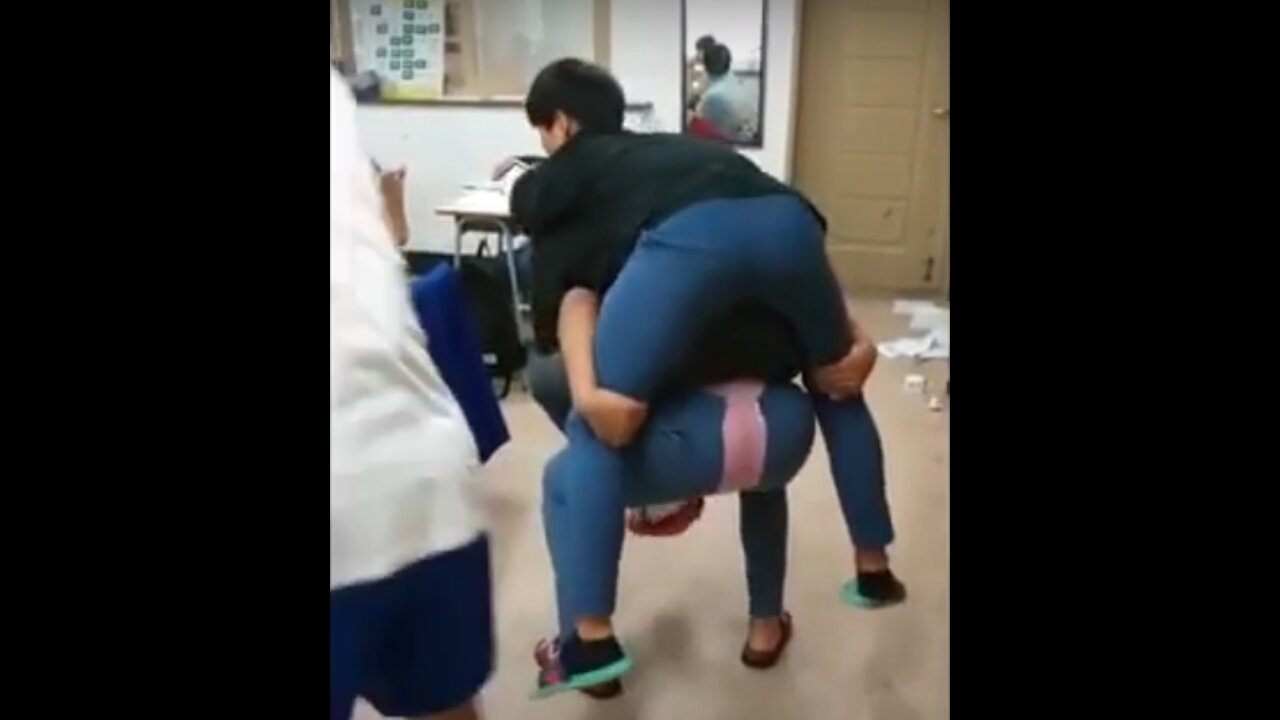 Guy Tries to piggyback Two people Ends Up Ripping His Pants