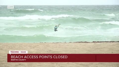 Wind surfers on Stuart Beach as impacts from Isaias are felt