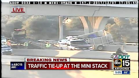 Landscaping trailer hanging off Loop 202