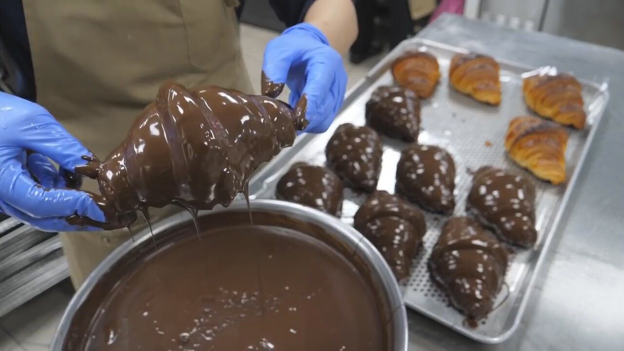 Tasty artisan croissant filled with chocolate coating - Korean street food