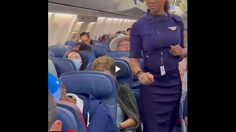 A flight attendant surprised her father, whom she hadn't seen for over a year, during a flight.