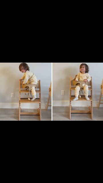 Fearless toddler climbs into high chair on his own