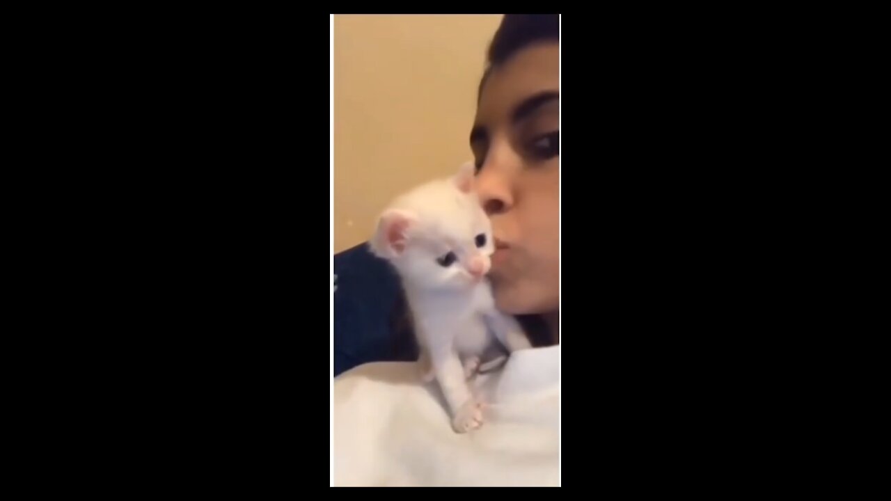 This cat is amazing it kissed her back really surprised