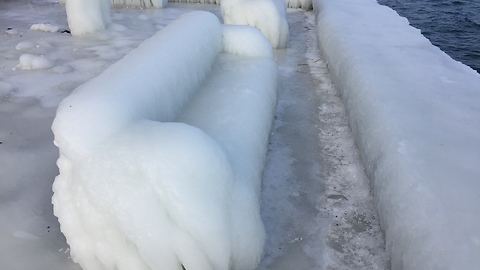Lakeside coast gets covered in thick layer of ice