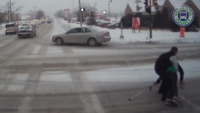 Bus driver shows MCTS Excellence, helps a woman with crutches cross the street