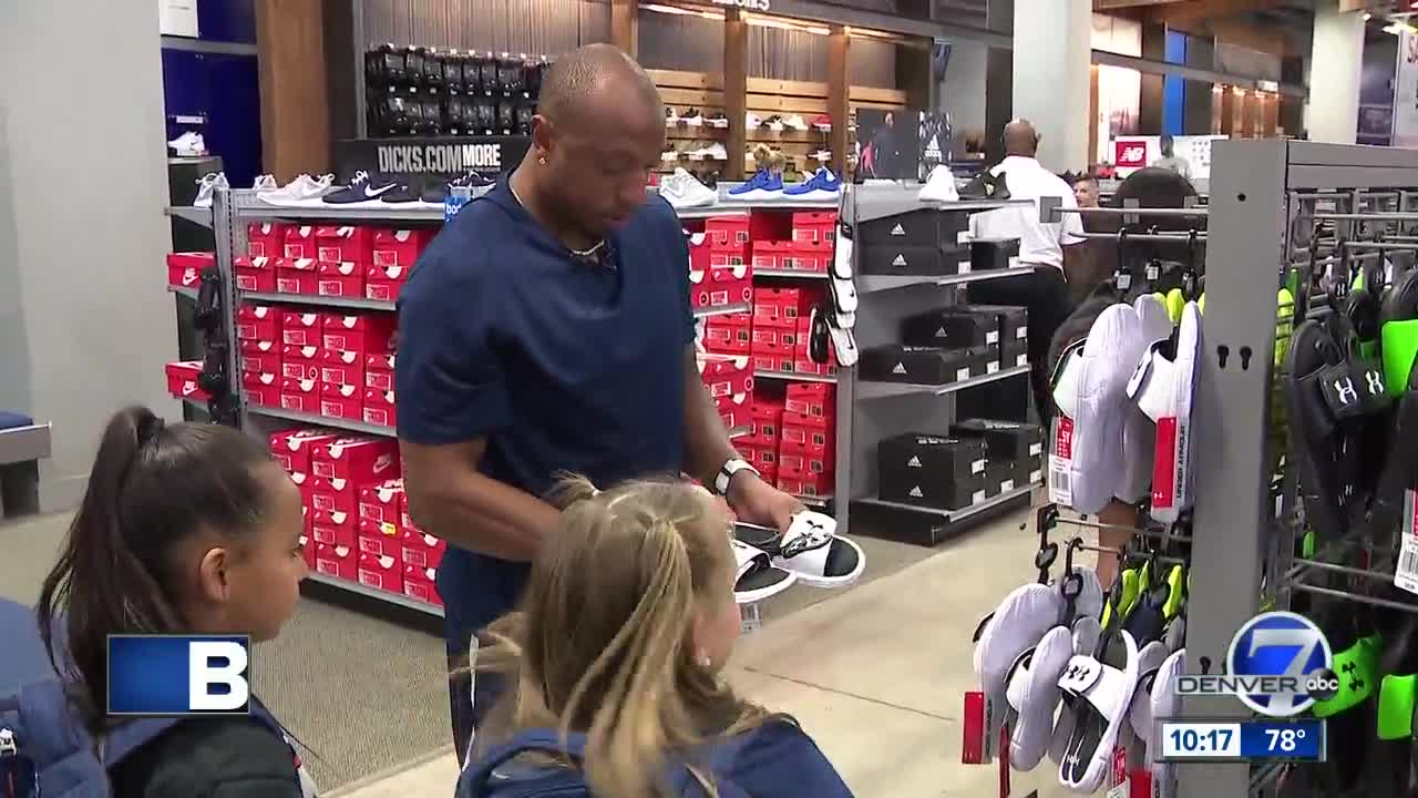 Broncos player Chris Harris Jr. goes on shopping spree with kids to help them start the new school year on the right foot