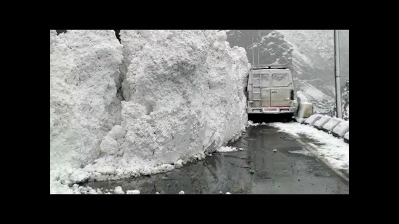 WATCH! SHOCKING 10-ft high glacier wall breaks off, slides onto highway in India