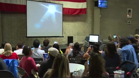 Las Vegas residents wait for a glimpse of solar eclipse at planetarium watch party