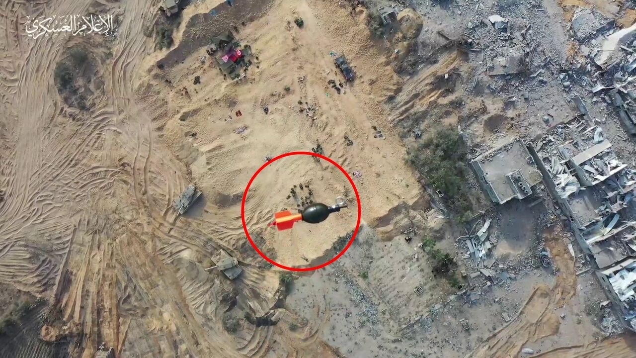 Palestinians drop a grenade from a quadrocopter on a cluster of IDF personnel