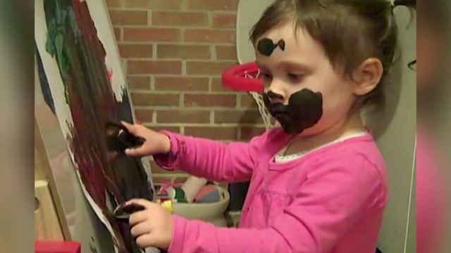 Hilarious Toddler Girl Uses Her Face To Paint A Picture