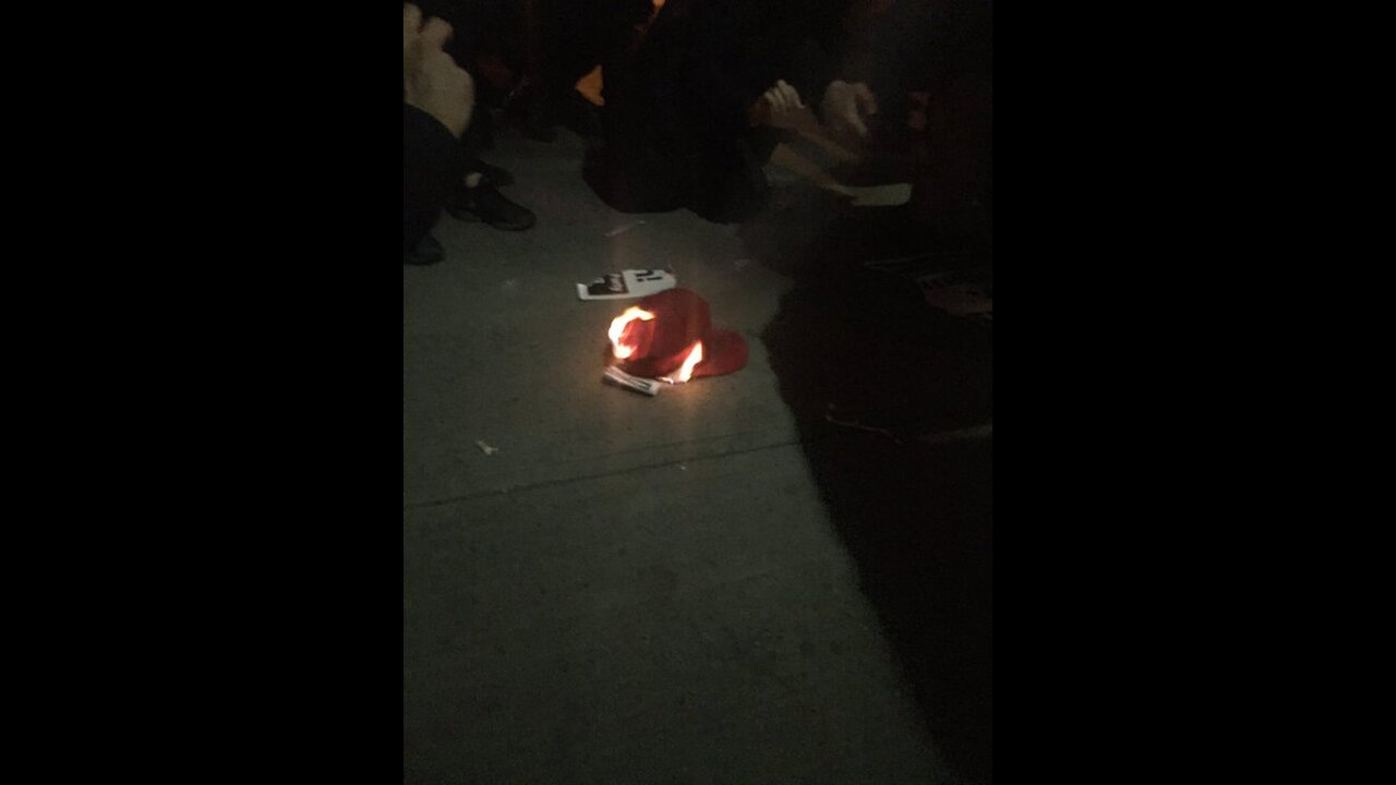 Feb 2 2017 NYU Gavins speech 2.1.1 Antifa chanting while they burn stolen MAGA hat, police put out fire