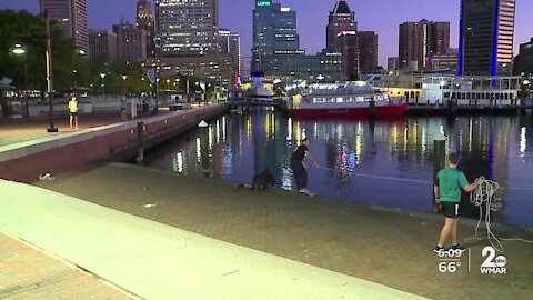 Man falls into the Inner Harbor and saved by joggers passing by