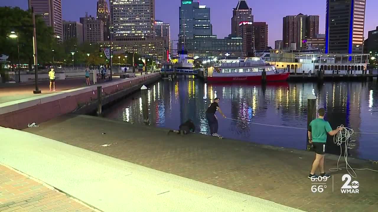 Man falls into the Inner Harbor and saved by joggers passing by