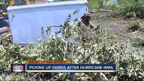 Picking up debris after Hurricane Irma