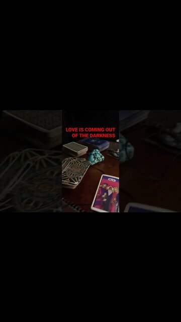 Tarot Card on the floor SPIRIT NEEDS YOU TO KNOW LOVE IS COMING OUT OF THE DARKNESS