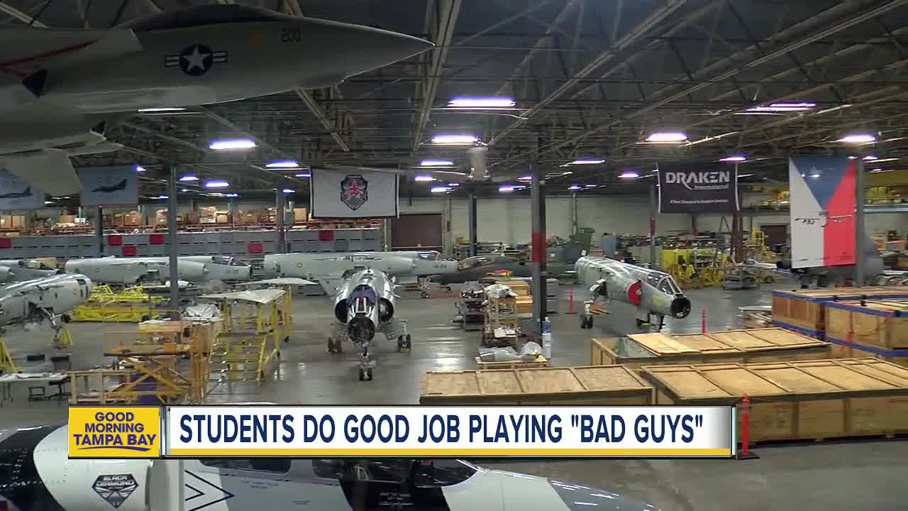 Local students play “bad guys” at aerospace firm