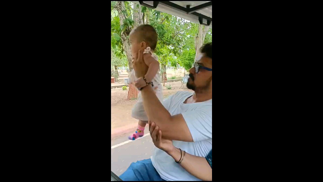 indian baby girl playing with daddy