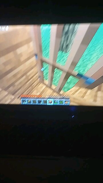 playing Minecraft on the mini bezos Max which is the temu smartphone