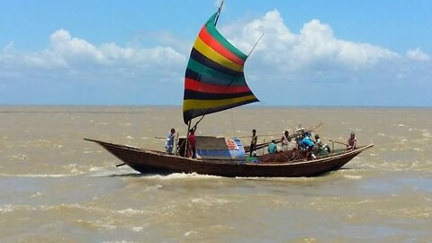 Sad song sitting on a boat in the middle of the river form Bangladesh