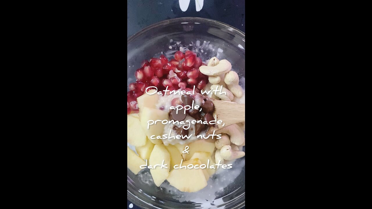 oatmeal with promagenade,apple,cashew nuts and dark chocolates
