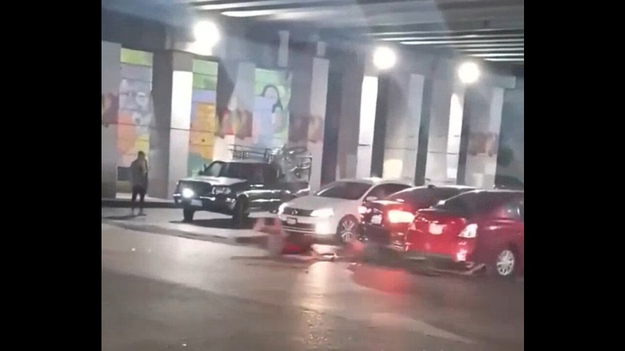 Guy kicks car, gets run over.