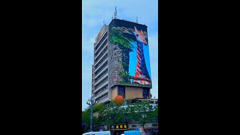 LED Video wall on outside of massive building attacks attention