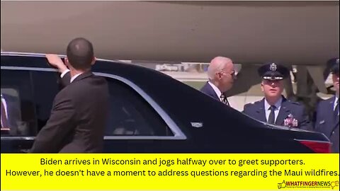 Biden arrives in Wisconsin and jogs halfway over to greet supporters.