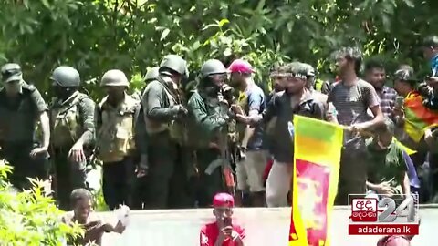 Anti-government protesters besiege and storm the prime minister's office in Sri Lanka's capital
