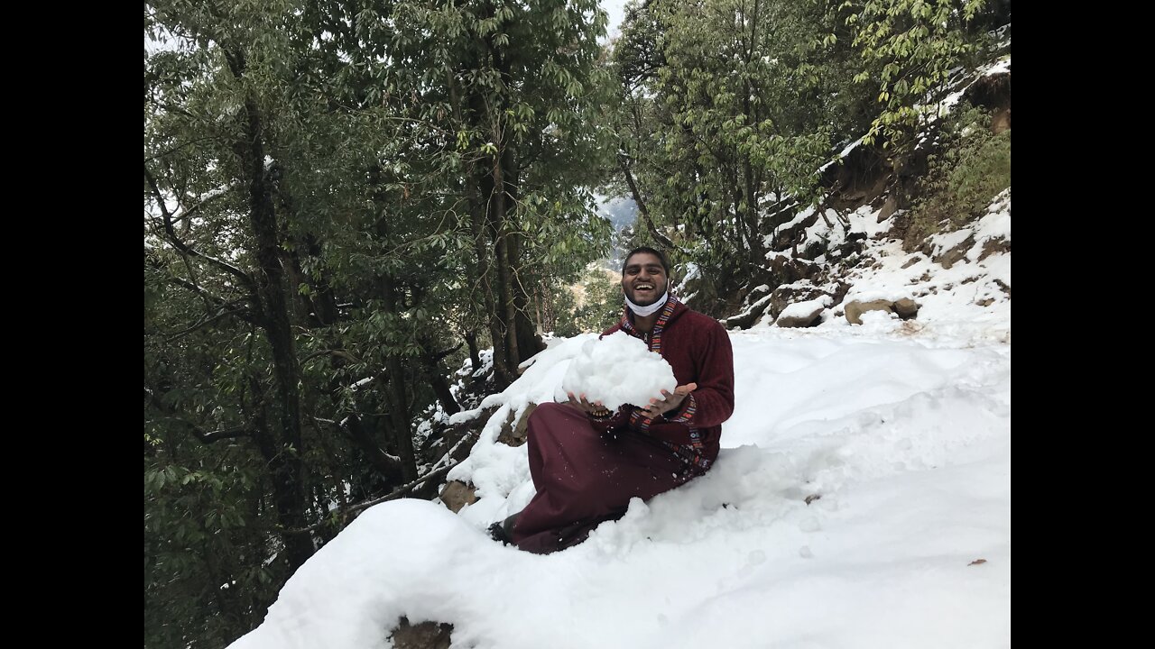 Indian Buddhist monk fun with snow