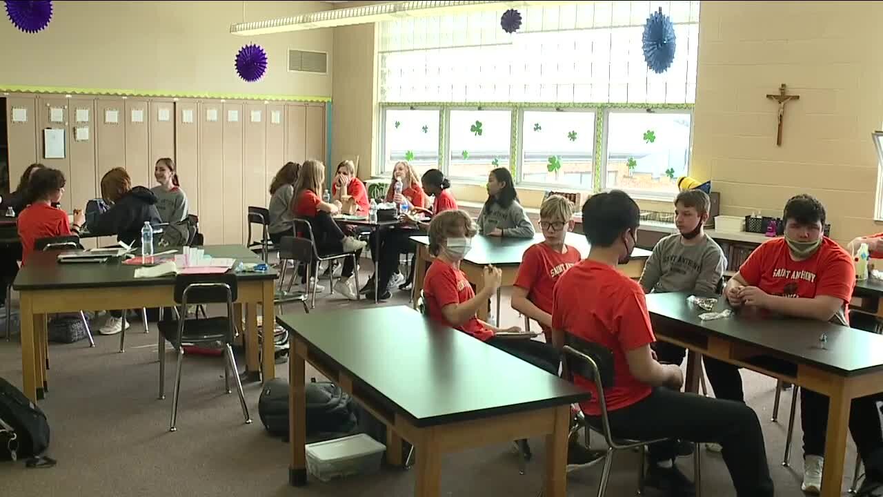 Students from St. Anthony of Padua classrooms destroyed by fire welcomed to new class with pizza, pups