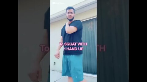 Squat with One Hand Up