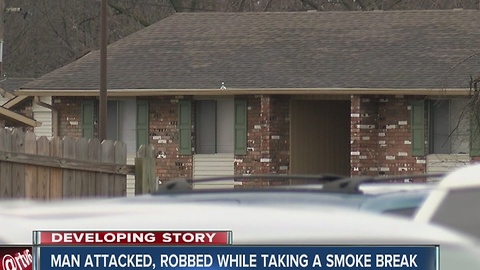 Man attacked, robbed while outside smoking