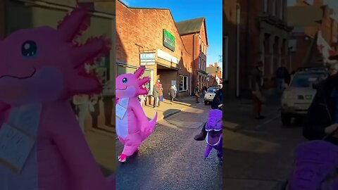 🦖 Ever seen a parade like this before? #viral #parade #dinosaur #christmas