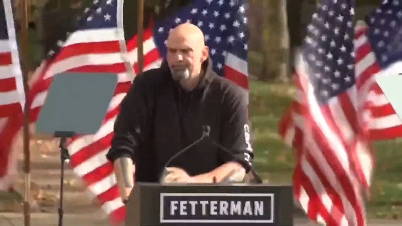 Fetterman says he is "ready to serve Pennsylvania" while American flags are being blown away