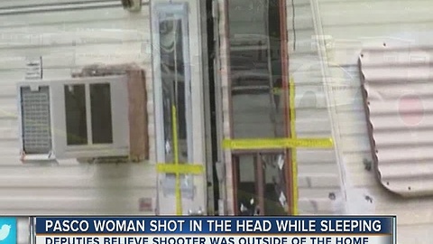 Woman shot in head while sleeping in trailer park