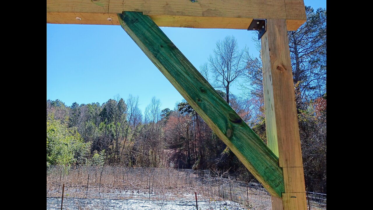 Installing knee braces on timber drying shed.