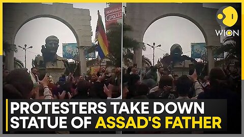 Syria Rebels: Protesters Take Down Statue Of Assad's Father | World News | WION